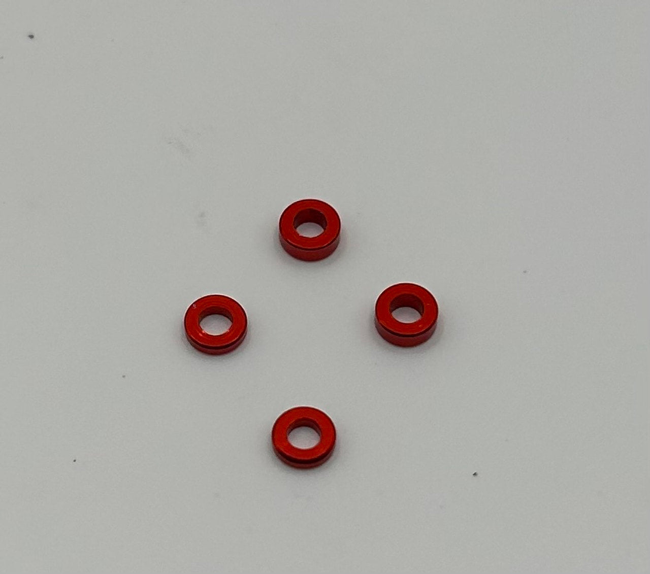 MWX PERFORMANCE - RED ANODIZED SHIMS - 1.0 & 1.5MM - (4 PCS)